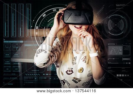 blonde girl playing and enjoy in virtual reality