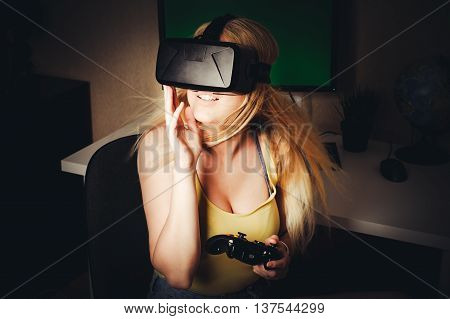 blonde girl playing and enjoy in virtual reality