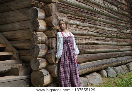 young girl in traditional Russian dress and sad