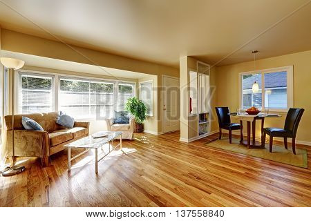 Open Dining Room With Hardwood Floor Connected To Dining Room