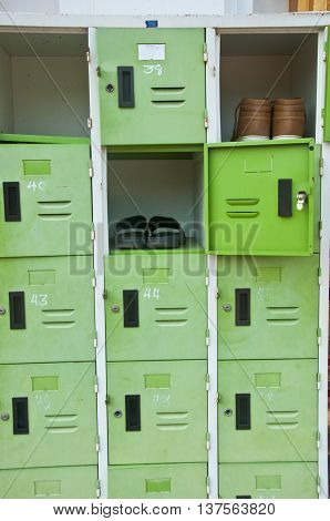 shoes in old green lockers at school