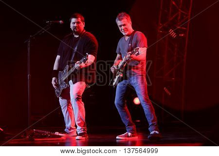 WANTAGH, NY-AUG 14: Eddie Van Halen (R) and son Wolfgang Van Halen of Van Halen perform onstage at Jones Beach Theater on August 14, 2015 in Wantagh, New York.