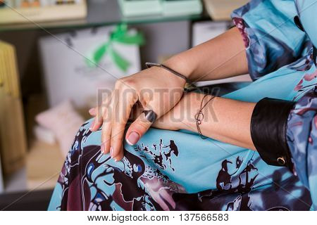 jewelry rings bracelets. Female hands closeup. Showcase background