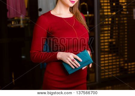 respectable woman holding wallet. Shopping center shopping go shopping.