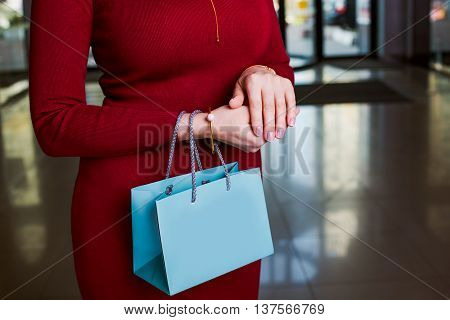 Shopping time.attractive Woman holding shopping bag. closeup hand