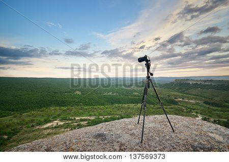 Professional digital camera on top mountain. Element of deign