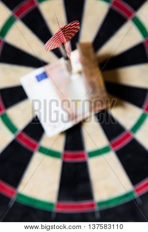 Dartboard With Steeldarts And Euro In It
