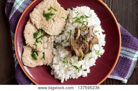 Pork loin fillets with rice and mushrooms