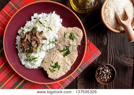 Pork loin fillets with rice and mushrooms