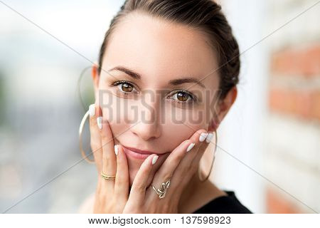 Closeup portrait of a girl, youth and beauty, soft and velvet skin. Make-up on her face
