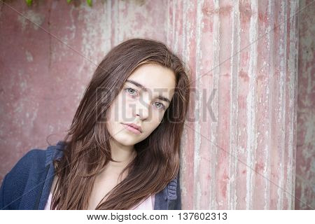 Portrait Of A Teenage Girl, Leaning Against An Ancient Pillar