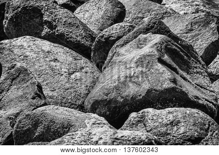 Close up from big Rocks at beach in black and white