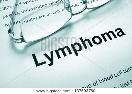 Paper with word lymphoma and glasses. Medical concept.