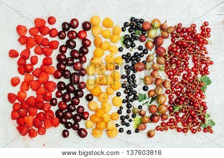 Colorful Mix Of Fruits On Black Background. View From Above. Fresh Organic Berries ,  So You Can Eat