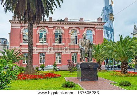 BATUMI GEORGIA - MAY 24 2016: The Memed Abashidze statue among the greenery in the Europe Square on May 24 in Batumi.