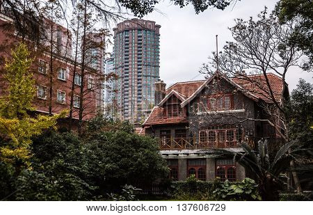 Shanghai China traditional old house building and new modern skyskraper tower