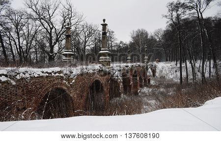 beautiful vintage bridge on a winter afternoon from a brick