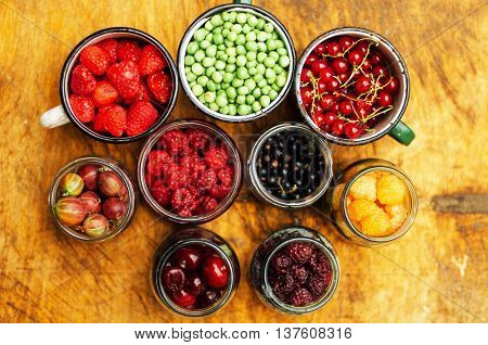Colorful Mix Of Fruits On Black Background. View From Above. Fresh Organic Berries ,  So You Can Eat