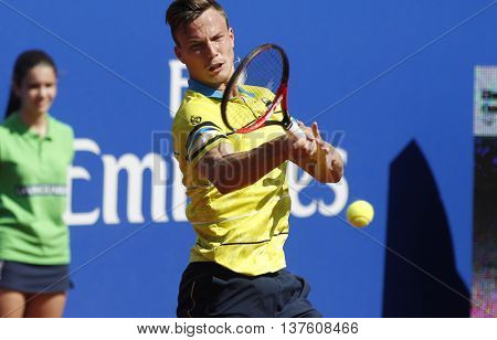 BARCELONA - APRIL,19: Hungarian tennis player Marton Fucsovics in action during a match of Barcelona tennis tournament Conde de Godo on April 19, 2016 in Barcelona