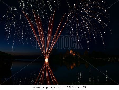 Fireworks in Trakai, Lithuania. Trakai Castle at night - Island castle in Trakai is a museum and a cultural center, Lithuania. Fireworks in Lithuania