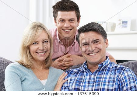 Portrait Of Family With Adult Son At Home