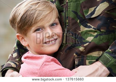 Son Hugging Military Father Home On Leave