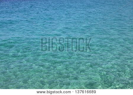 Blue sea water with waves and ripples. Sea background. Adriatic sea, Europe, Italy.