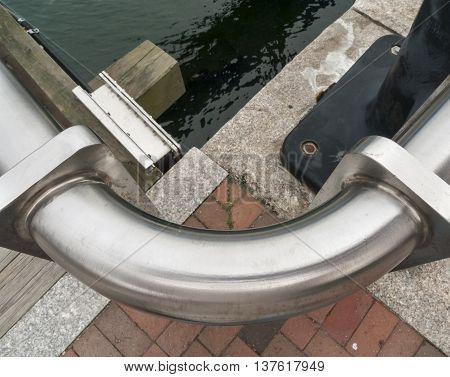 Guard rail curves along edge of Harborwalk in Boston