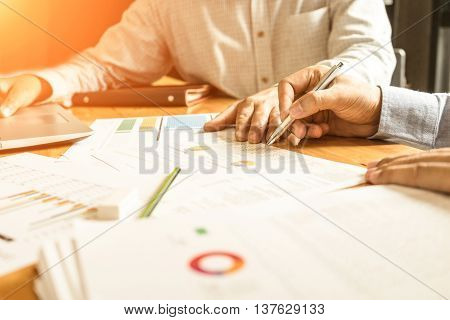 Business business partners discussing documents and ideas at meeting Business concept soft focus vintage tone