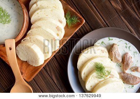 Turkey meat with dill sauce and bread dumpling