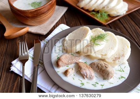 Turkey meat with dill sauce and bread dumpling