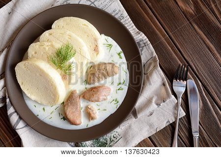 Turkey meat with dill sauce and bread dumpling
