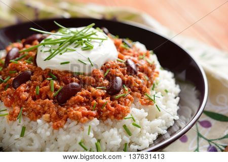 Mexican food Chili con carne on a wooden background