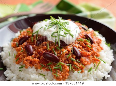 Mexican food Chili con carne on a wooden background