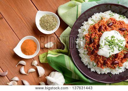 Mexican food Chili con carne on a wooden background