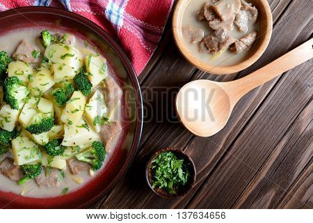 Pork with broccoli, ginger root and boiled potatoes