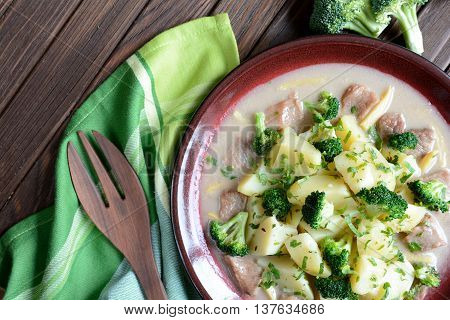 Pork with broccoli, ginger root and boiled potatoes