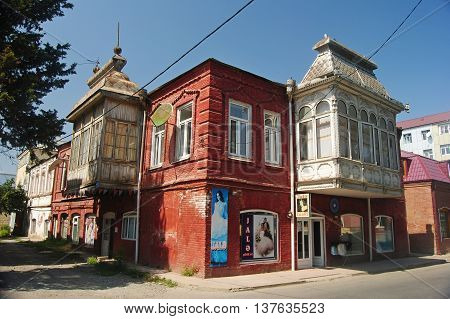 Quba, Azerbaijan - August 23, 2014. Typical 19th-century house in central Quba, with beauty salon on the ground floor, with historic balconies.