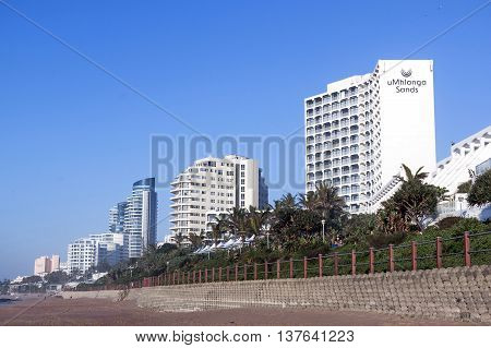 Beach Front City Skyline Against Blue Sky