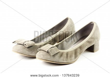 Pair of female shoes over white background