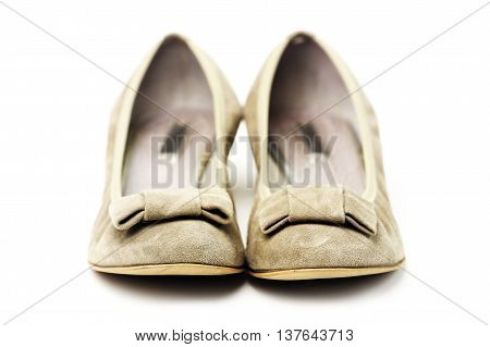 Pair of female shoes over white background