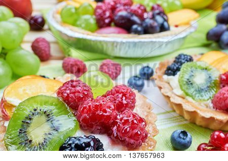 Mix of fruit tarts and fresh fruits