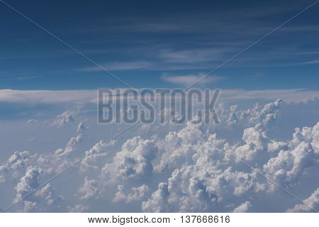 Beautiful blue sky and cloud view from an airplane window.