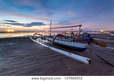 Holiday in Bali, Indonesia - Reflection Sunrise in Tanjong Benoa with boat