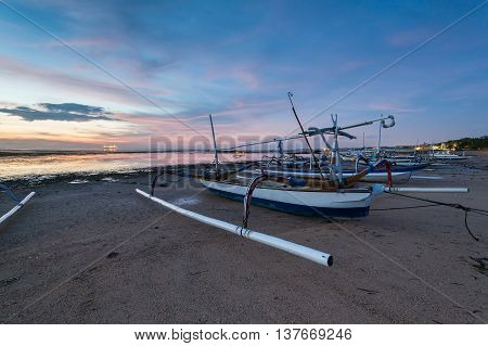 Holiday in Bali, Indonesia - Reflection Sunrise in Tanjong Benoa with boat