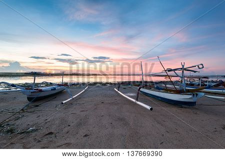 Holiday in Bali, Indonesia - Reflection Sunrise in Tanjong Benoa with boat