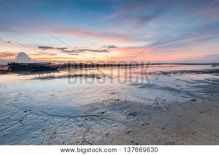 Holiday in Bali, Indonesia - Reflection Sunrise in Tanjong Benoa with boat