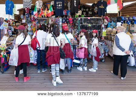 SIRACUSA ITALY - MAY 18: Gift shop with girl pupils on May 18 2016 near the Greek theatre of Syracusa at the island Sicily Italy