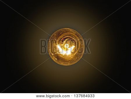 light bulb lit on a black backgroundsoft focus