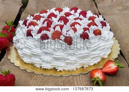 Light, delicate and tasty cream cake with fresh strawberries (half cake)